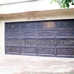 Custom iron garage door for a coastal home made by Universal Iron Doors