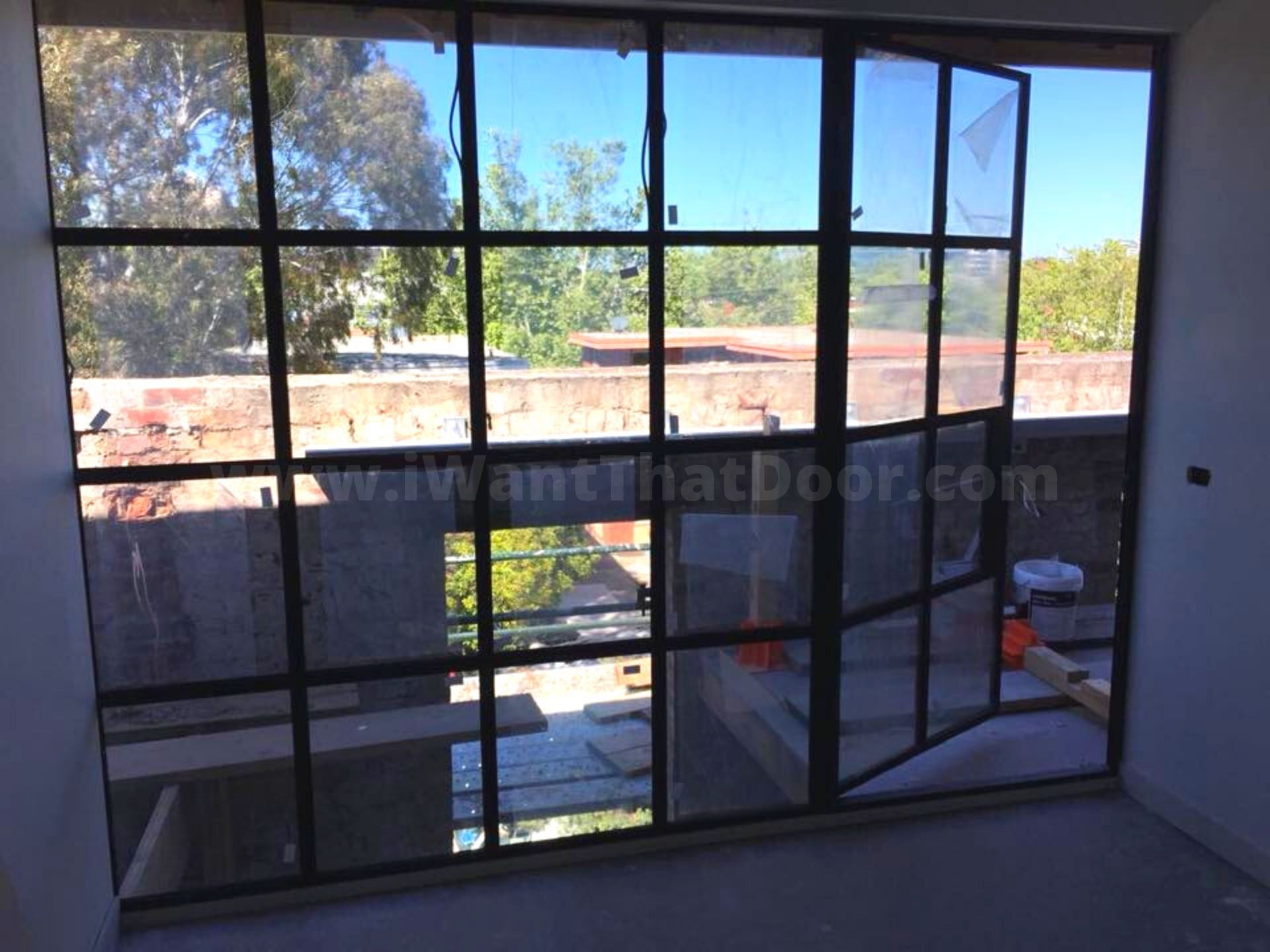 Custom designed window for a kitchen renovation by Universal Iron Doors