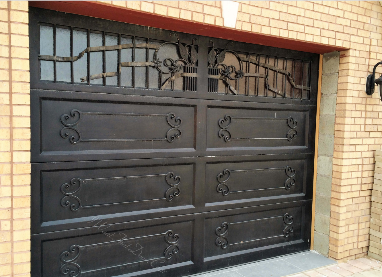 Iron security garage door for luxury home made by Universal Iron Doors