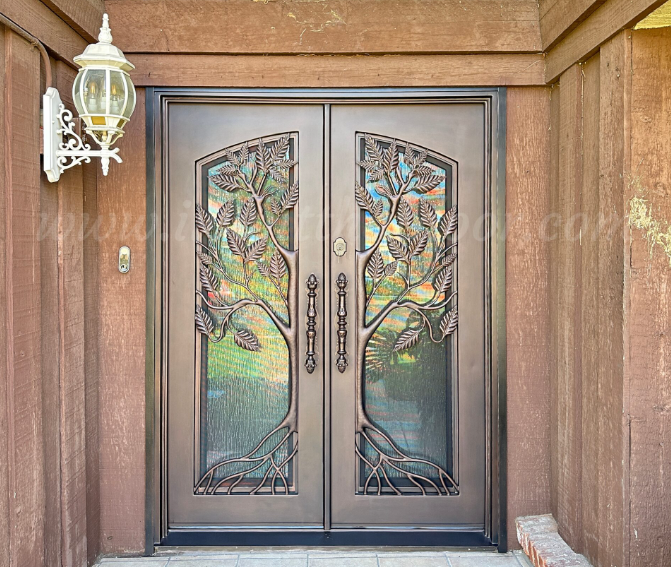 Biophilic tree design on a wrought iron door from Universal Iron Doors